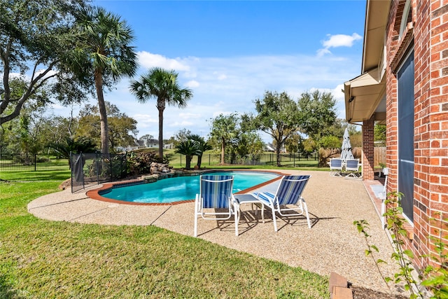 view of swimming pool with a lawn and a patio area