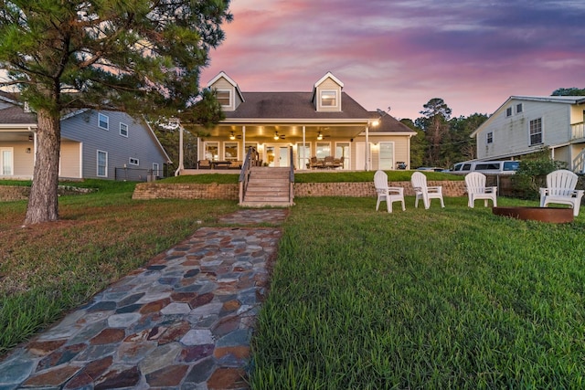 172 Little Dove, Livingston, TX 77351 - new england style home featuring a yard, a ceiling fan, and covered porch