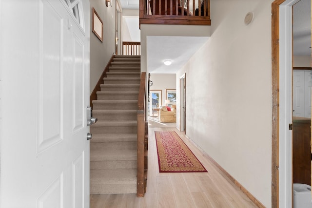 172 Little Dove, Livingston, TX 77351 - foyer entrance with stairway, wood finished floors, and baseboards