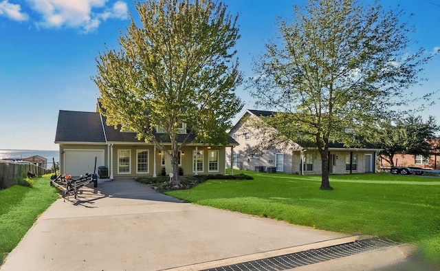 view of front of house featuring a front yard and a garage