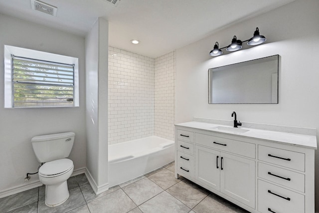 full bathroom with tile patterned flooring, vanity, toilet, and tiled shower / bath combo