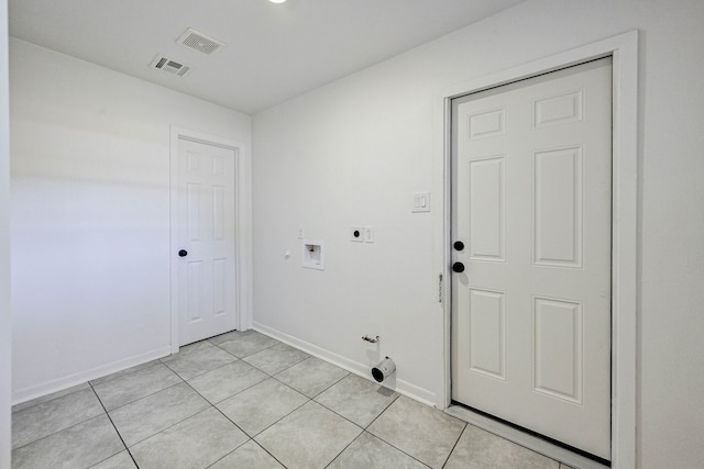 laundry area featuring hookup for an electric dryer, hookup for a washing machine, light tile patterned floors, and gas dryer hookup