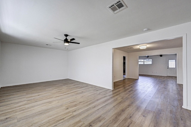 spare room featuring ceiling fan and light hardwood / wood-style floors