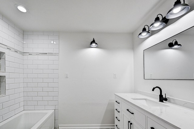 bathroom featuring vanity and tiled shower / bath combo