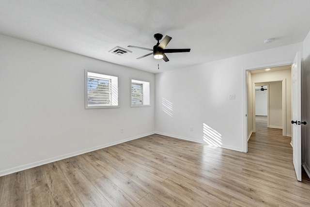 empty room featuring light hardwood / wood-style floors and ceiling fan