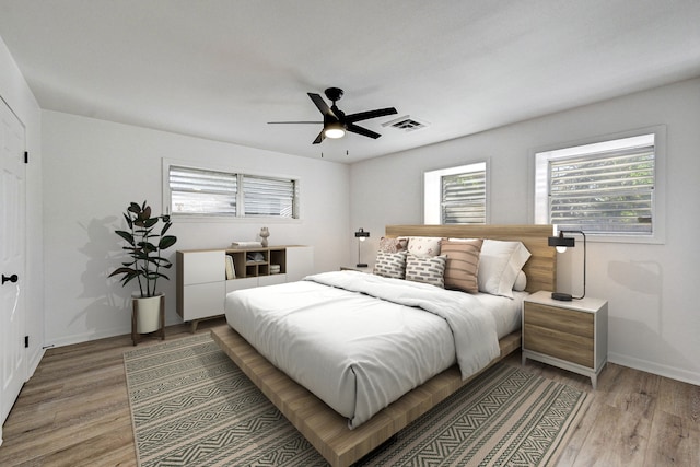 bedroom featuring hardwood / wood-style flooring and ceiling fan