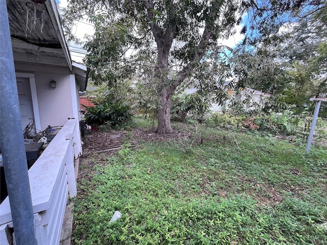 view of yard with a balcony