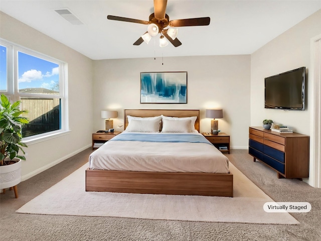 5122 Breezy Parke Ln, Rosenberg, TX 77469 - carpeted bedroom featuring baseboards and a ceiling fan