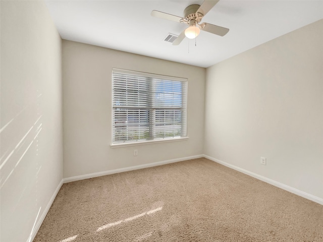 carpeted empty room with ceiling fan