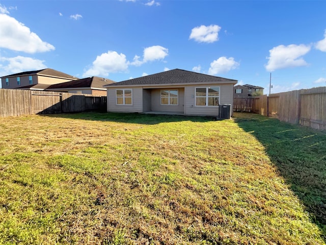 back of property featuring a lawn