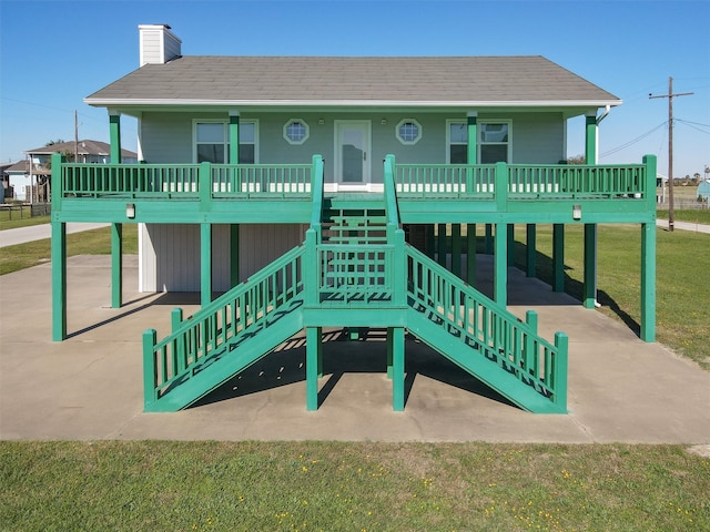 exterior space with a lawn and a porch