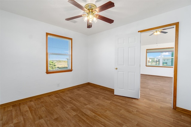 unfurnished room with ceiling fan and light hardwood / wood-style flooring