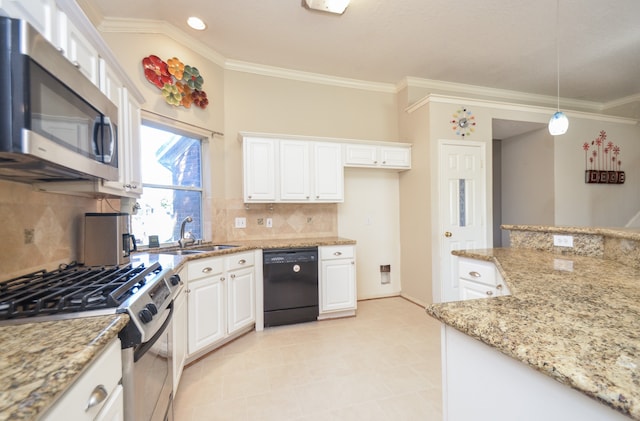 kitchen with decorative backsplash, appliances with stainless steel finishes, light stone counters, pendant lighting, and white cabinets