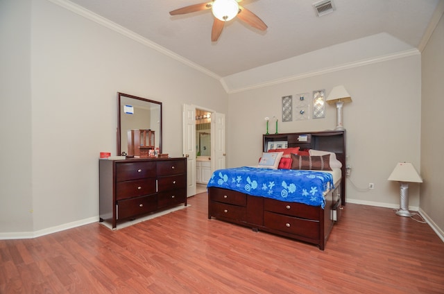 bedroom with ensuite bath, light hardwood / wood-style flooring, ceiling fan, and crown molding