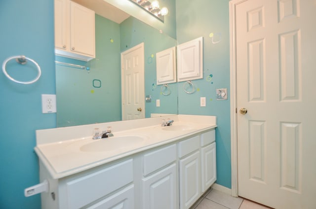 bathroom featuring tile patterned flooring and vanity