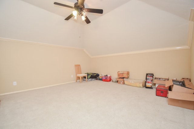 recreation room featuring ceiling fan, crown molding, lofted ceiling, and carpet floors