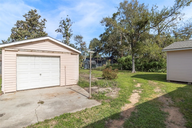 garage featuring a yard