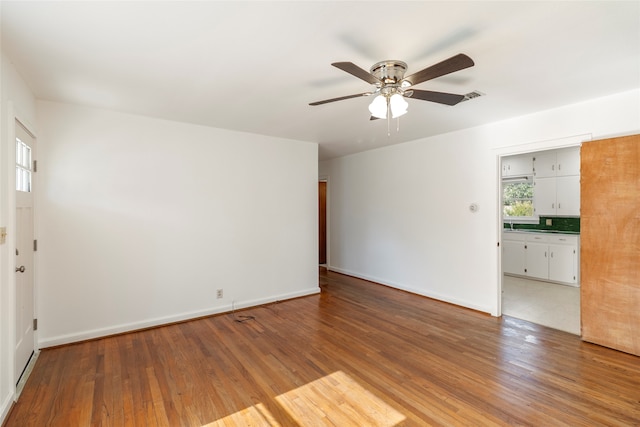 spare room featuring ceiling fan and hardwood / wood-style floors