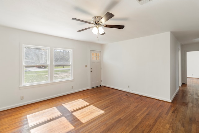 unfurnished room featuring ceiling fan and hardwood / wood-style floors