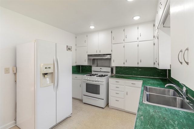 kitchen featuring sink, white appliances, white cabinetry, and tasteful backsplash