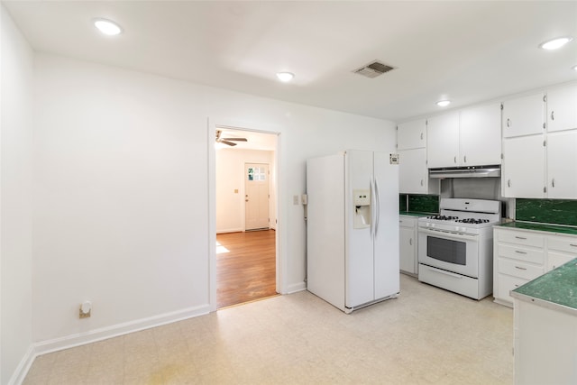 kitchen with ceiling fan, white appliances, and white cabinets