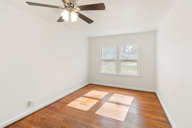 empty room with hardwood / wood-style flooring