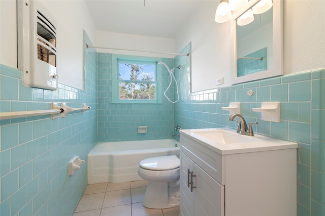 full bathroom with tile patterned floors, tile walls, tiled shower / bath combo, toilet, and vanity