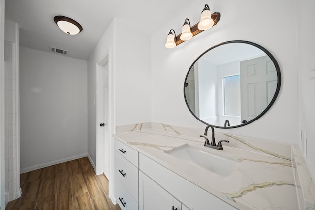 bathroom featuring hardwood / wood-style floors and vanity