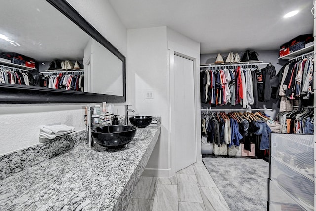 walk in closet with sink