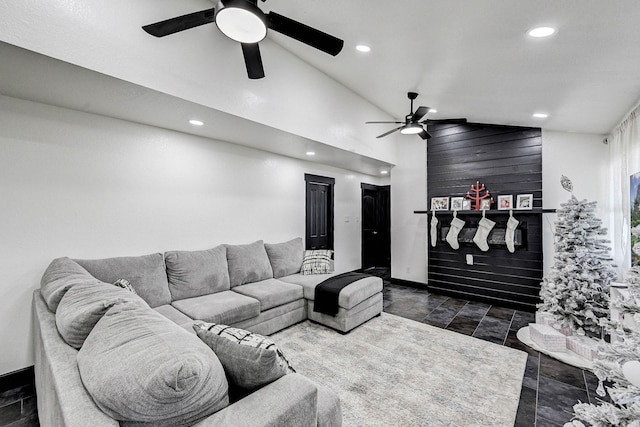 living room with ceiling fan and lofted ceiling