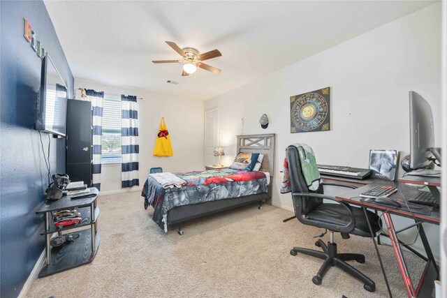 bedroom with light carpet and ceiling fan