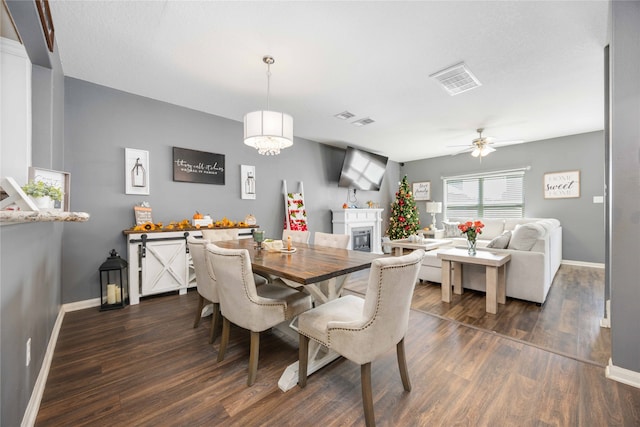 dining space featuring dark hardwood / wood-style floors and ceiling fan