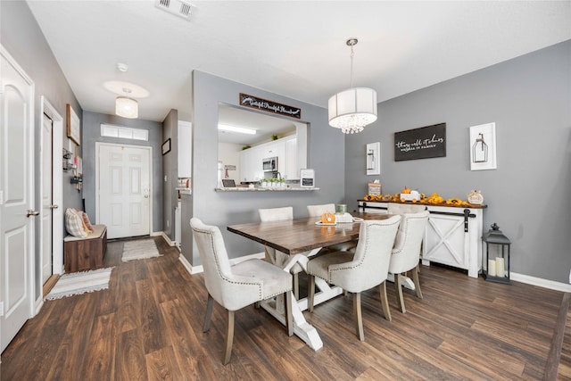 dining room featuring dark wood-type flooring