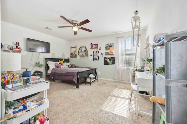 bedroom featuring ceiling fan and light carpet