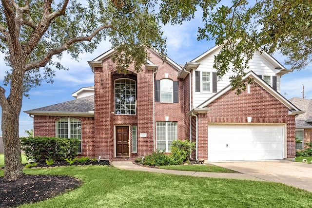 front facade featuring a garage and a front yard