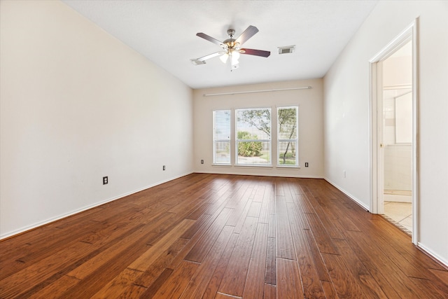 empty room featuring ceiling fan and hardwood / wood-style floors