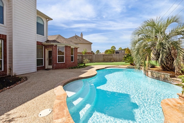 view of swimming pool with pool water feature