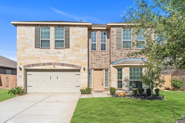 view of front of property with a front lawn and a garage