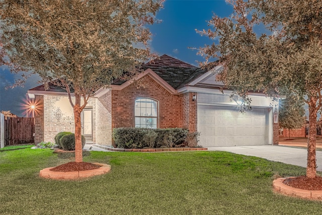 view of front facade featuring a front yard and a garage