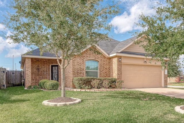 ranch-style home featuring a garage and a front yard