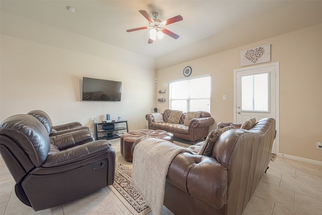 living room featuring light tile patterned floors and ceiling fan