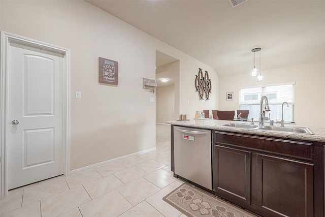 kitchen featuring light stone countertops, stainless steel dishwasher, dark brown cabinets, sink, and hanging light fixtures