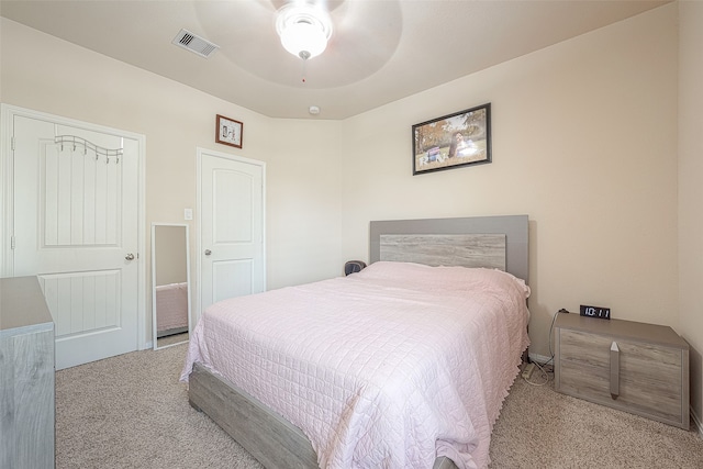 carpeted bedroom with ceiling fan