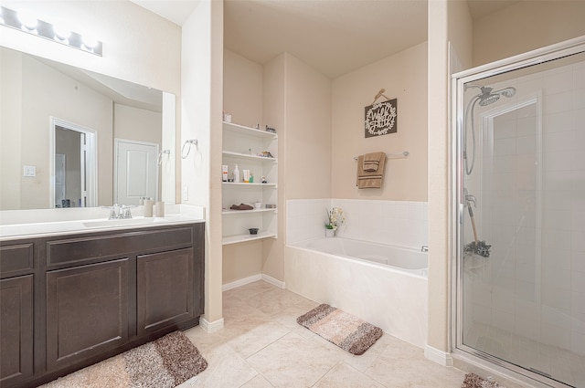 bathroom with tile patterned flooring, vanity, and independent shower and bath