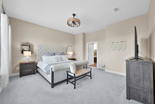 bedroom with light colored carpet