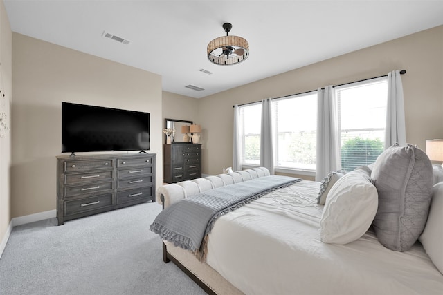 bedroom with light colored carpet