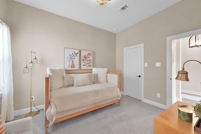 bedroom featuring light colored carpet