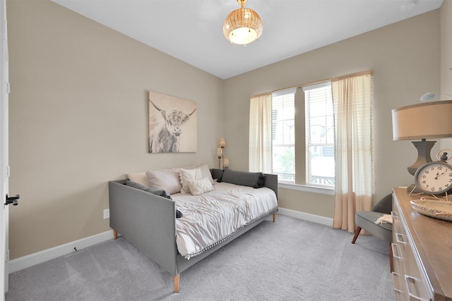 bedroom with light colored carpet