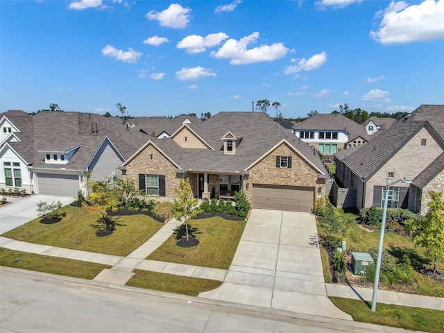 craftsman-style house featuring a front lawn and a garage