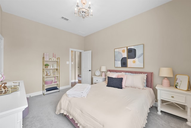 carpeted bedroom with an inviting chandelier